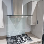 Hob with glass spashback