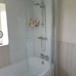 Bath with built in shower