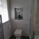 Bathroom with built in shelf