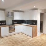 White kitchen with wooden worktops